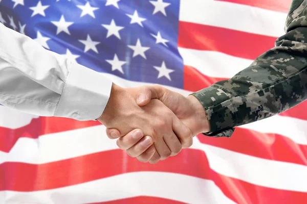 Soldier and civilian shaking hands on USA flag background — Stock Photo, Image