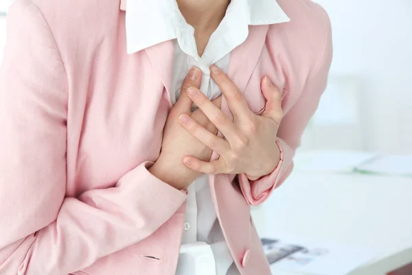 Woman suffering from chest pain — Stock Photo, Image