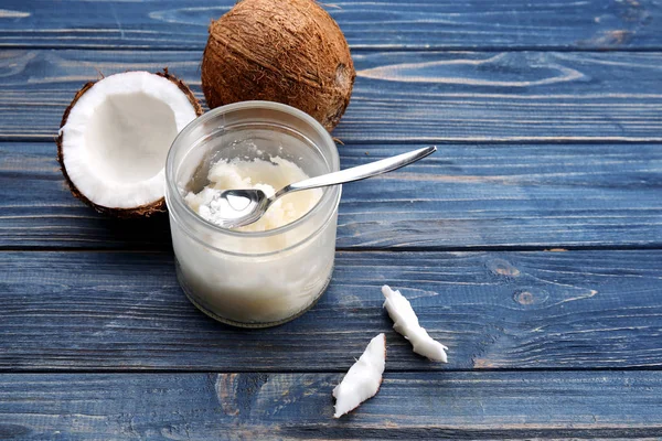 Opened glass jar with coconut oil — Stock Photo, Image