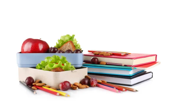 Lunchbox met voedsel en briefpapier op witte achtergrond — Stockfoto