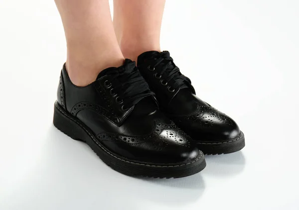 Legs in black brogue shoes — Stock Photo, Image