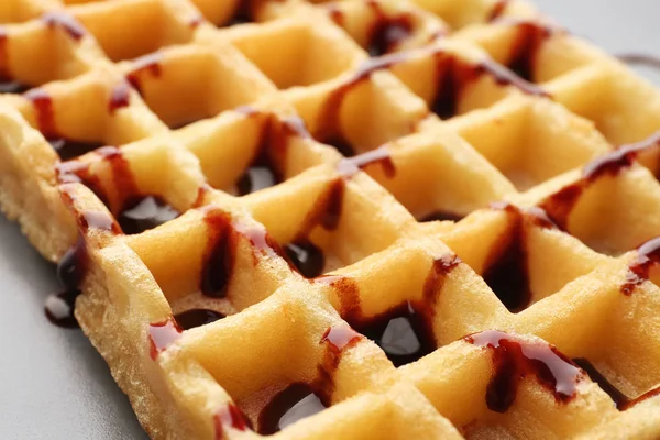 Delicious wafer cells with chocolate syrup — Stock Photo, Image