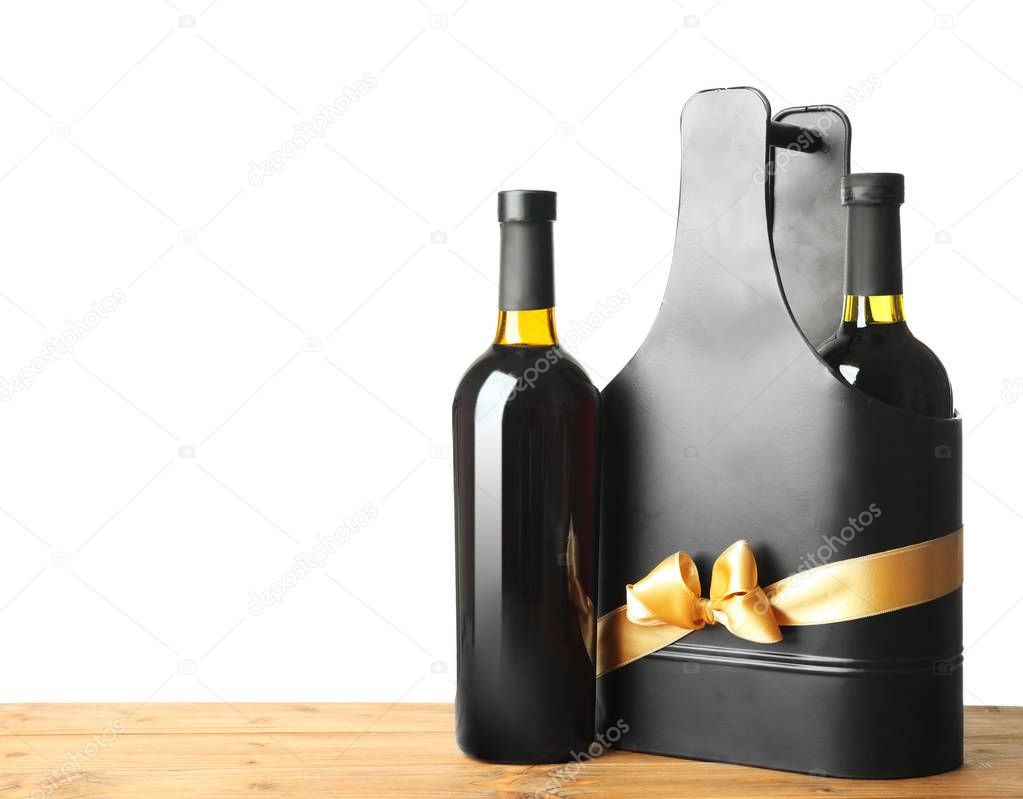 Table with wine bottles and gift box
