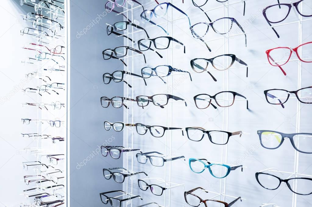 Showcase with glasses in modern optic store