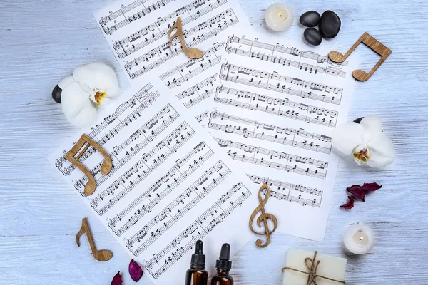 Composition of music sheets and spa supplies