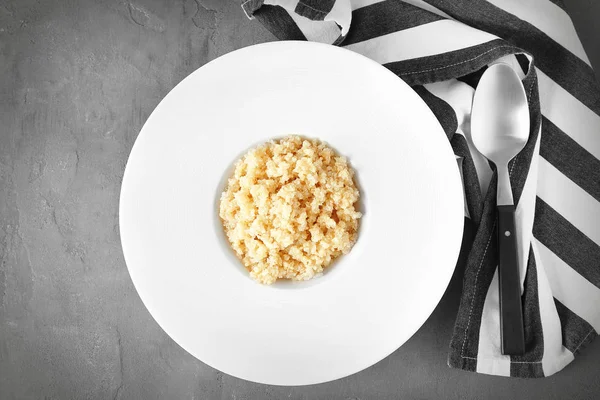 White plate with quinoa porridge — Stock Photo, Image