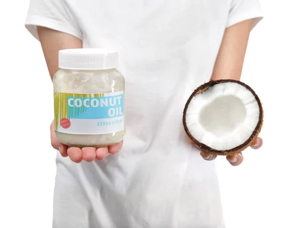 Young woman with coconut oil — Stock Photo, Image