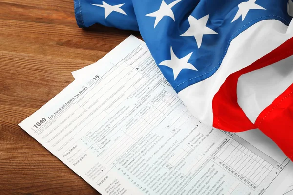 Individual tax return form and American flag