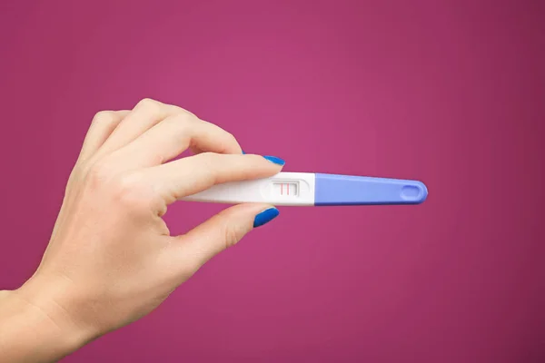 Pregnancy test in hand — Stock Photo, Image