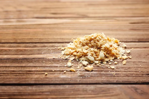 Breadcrumbs on wooden table — Stock Photo, Image