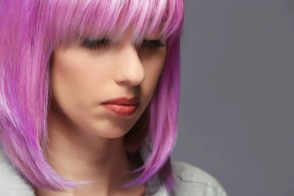 Beautiful young woman with dyed hair — Stock Photo, Image