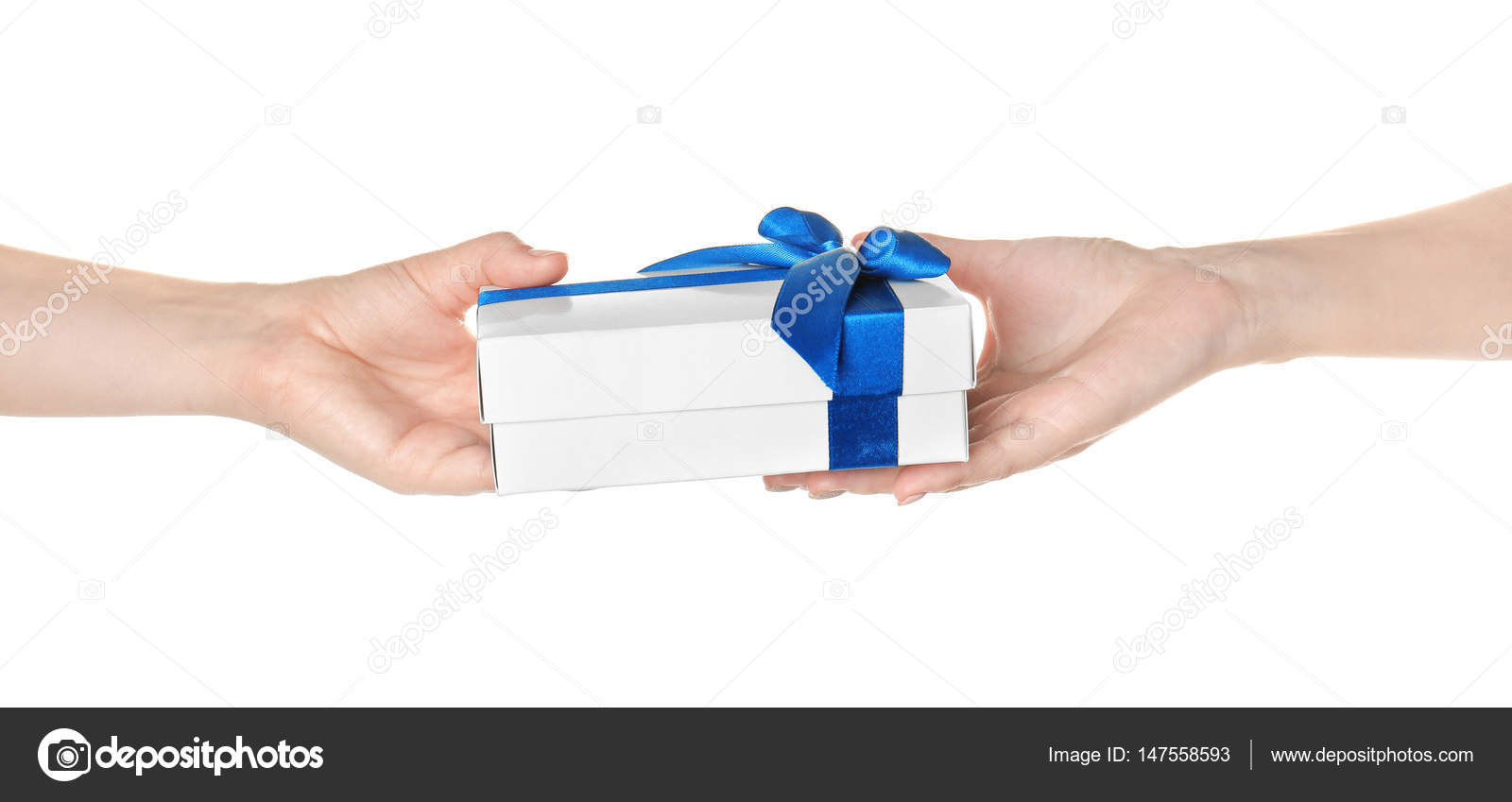 Hands giving and receiving gift box — Stock Photo © belchonock 147558593