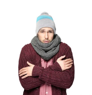 Young man shivering from cold  clipart