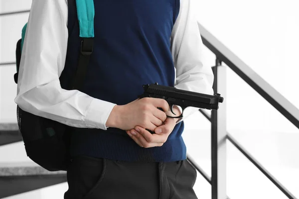 Schoolboy with gun in hands — Stock Photo, Image