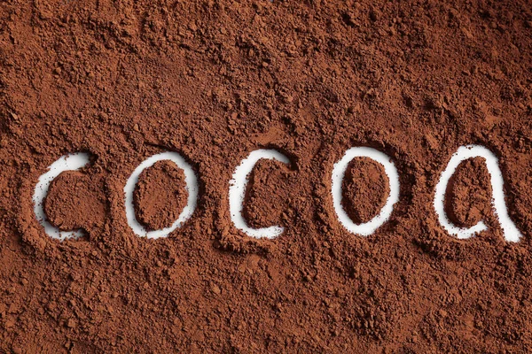 Word COCOA drawn on powder — Stock Photo, Image