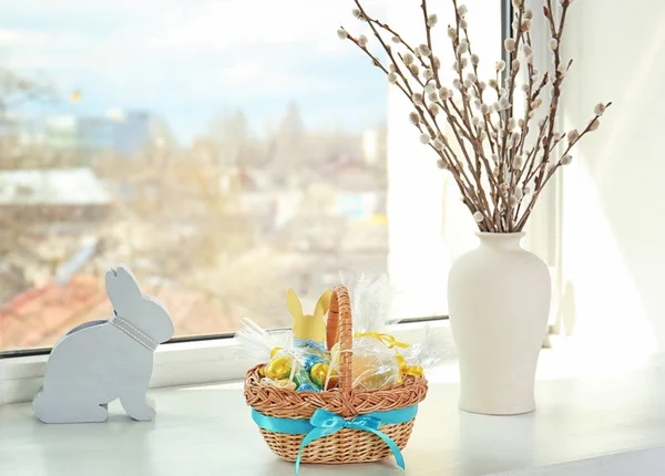 Easter basket with sweets and presents — Stock Photo, Image