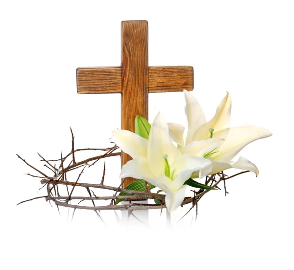 Crown of thorns, wooden cross and lily — Stock Photo, Image