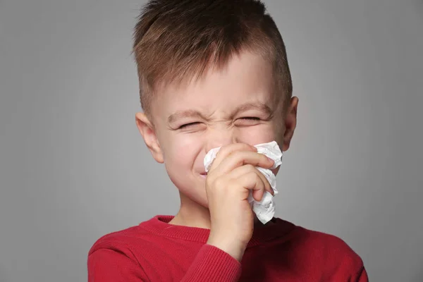 Cute little boy sneezing — Stock Photo, Image