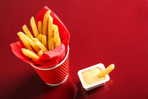 French fries with cheese sauce — Stock Photo, Image