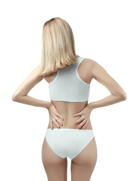 Junge Frau leidet unter Rückenschmerzen — Stockfoto