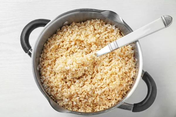 Pan with boiled brown rice — Stock Photo, Image