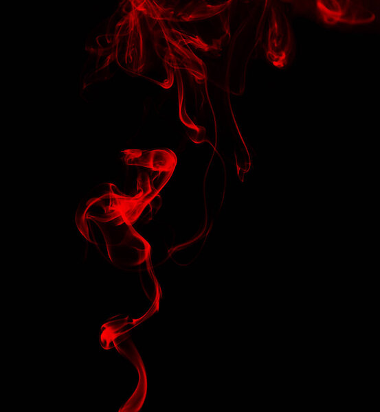 Swirl of red smoke on dark background