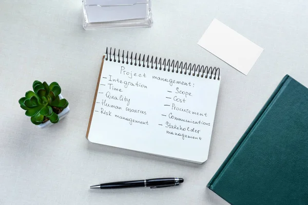 Notebook with written features — Stock Photo, Image