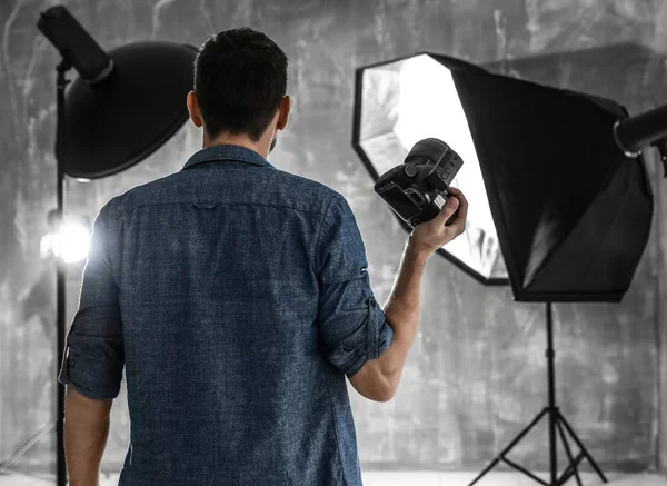 Male photographer in studio — Stock Photo, Image