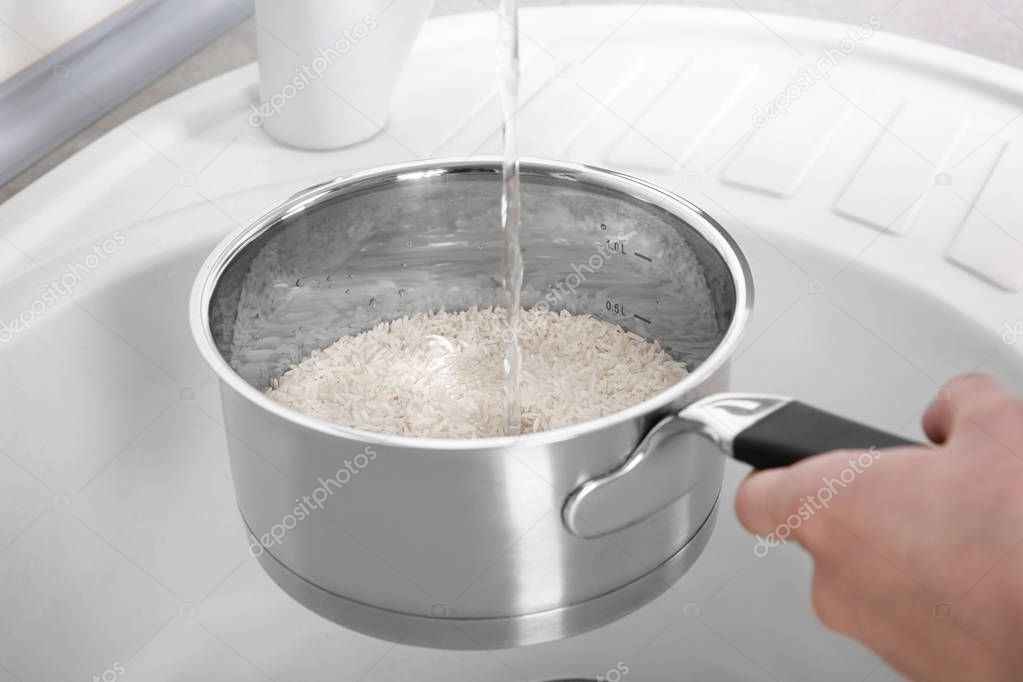 Woman rinsing rice