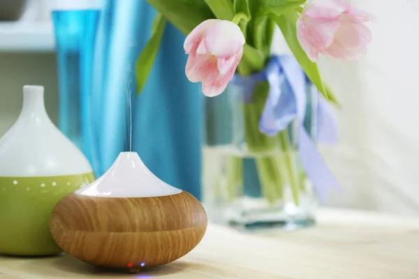 Aroma oil diffusers and flowers — Stock Photo, Image