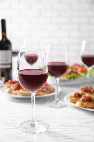 Tasty bruschetta served with wine