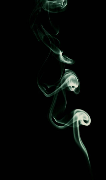 Swirl of light smoke on black background