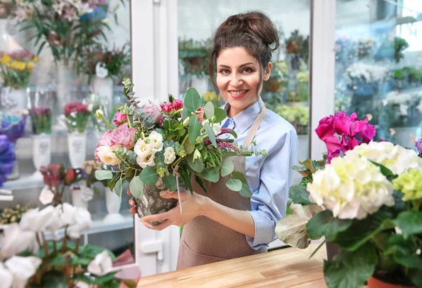 Beautiful woman florist — Stock Photo, Image