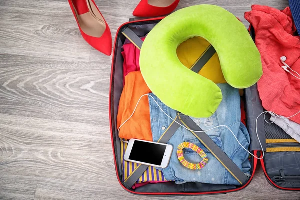 Suitcase with different things — Stock Photo, Image