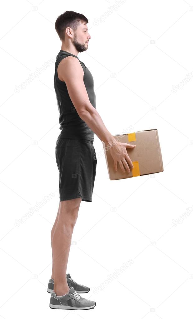 Man lifting heavy cardboard box 