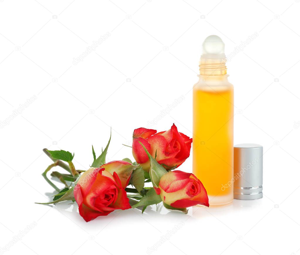 Bottle with perfume oil and rosebuds 