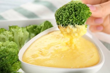 Delicious broccoli with cheese sauce clipart