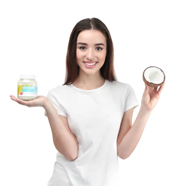 Woman with jar of coconut oil — Stock Photo, Image