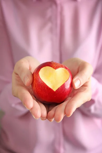 apple with heart-shaped cut out