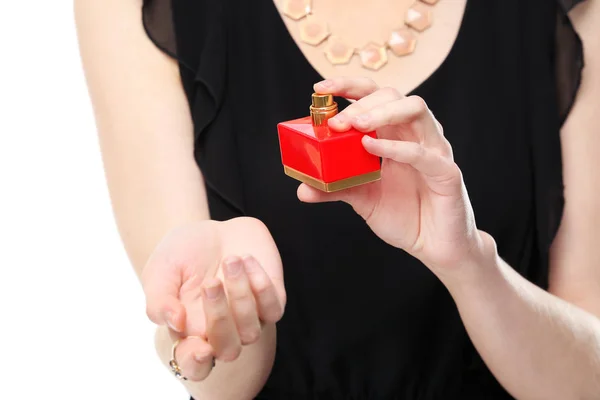 Mujer joven con botella de perfume — Foto de Stock