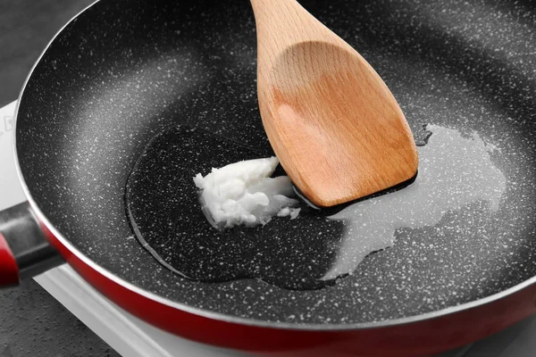 Spoon with coconut oil — Stock Photo, Image