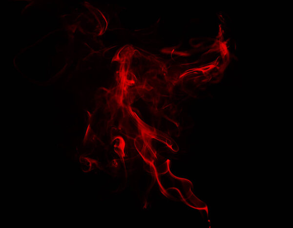 Swirl of red smoke on dark background