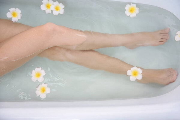 Legs of  woman taking bath 
