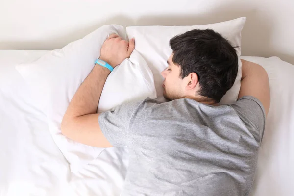 Young man with sleep tracker