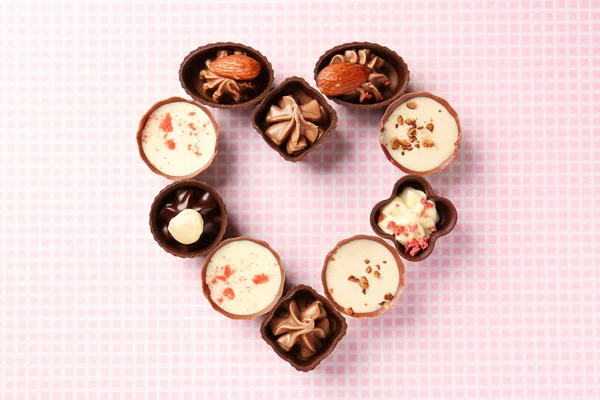 Heart-shaped collection of chocolate candies — Stock Photo, Image