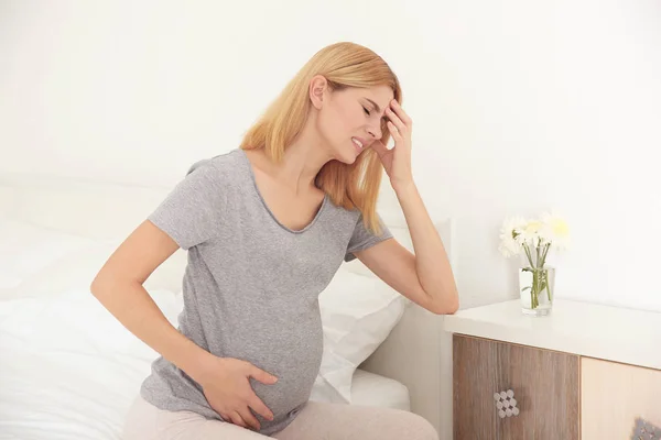 Pregnant woman suffering from pain — Stock Photo, Image