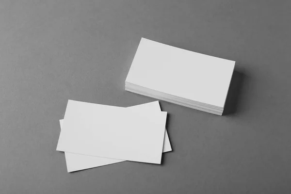 Blank business cards on grey background — Stock Photo, Image