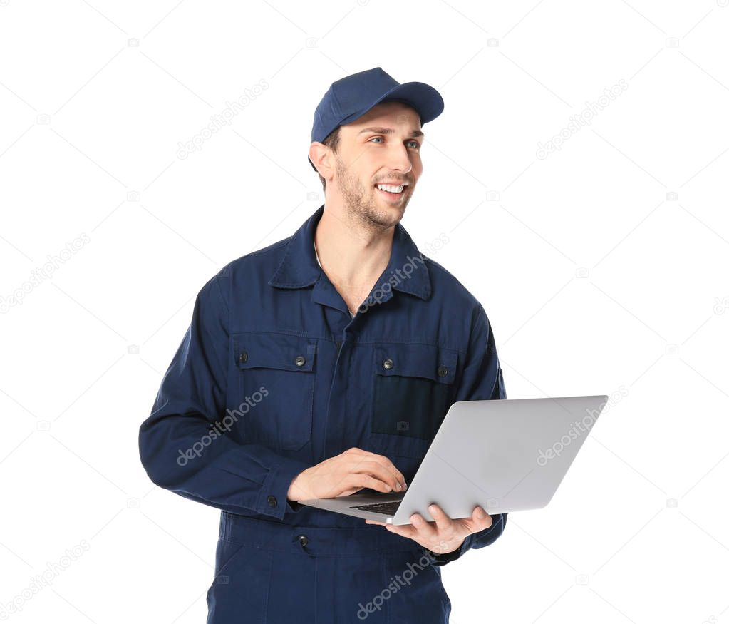 Handsome auto mechanic with laptop 