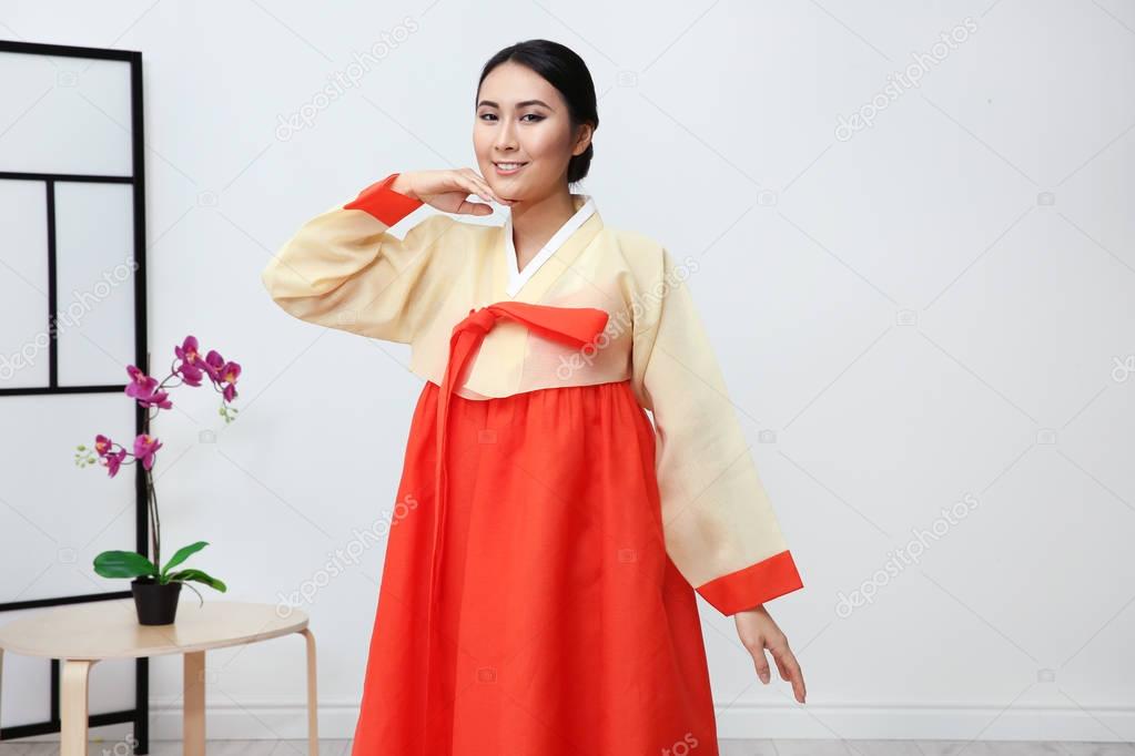  woman in Korean traditional costume dancing