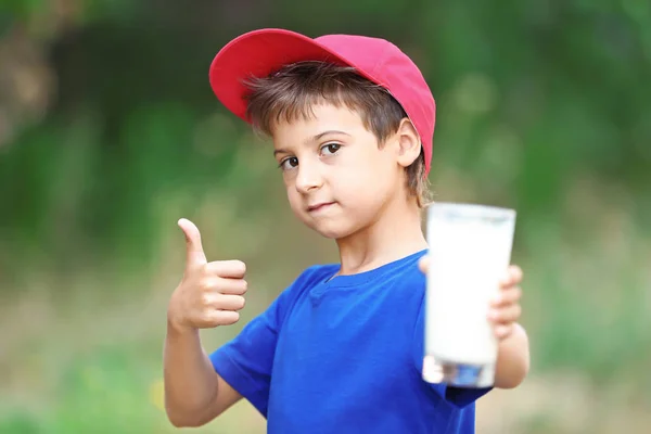 Kid  holding glass of milk — Stock Photo, Image